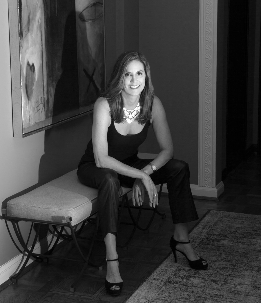 black and white photo of Amy Youngblood sitting on a bench